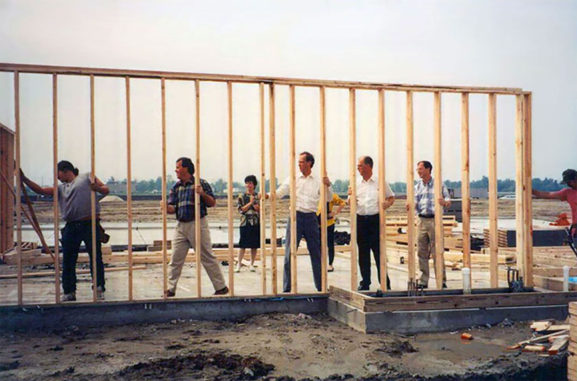 Clint Atkins helping to put up a wall.